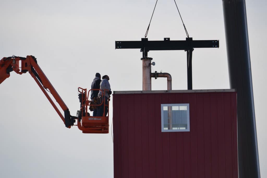 Slideshow Image of Black Dirt Distillery - Men in crane